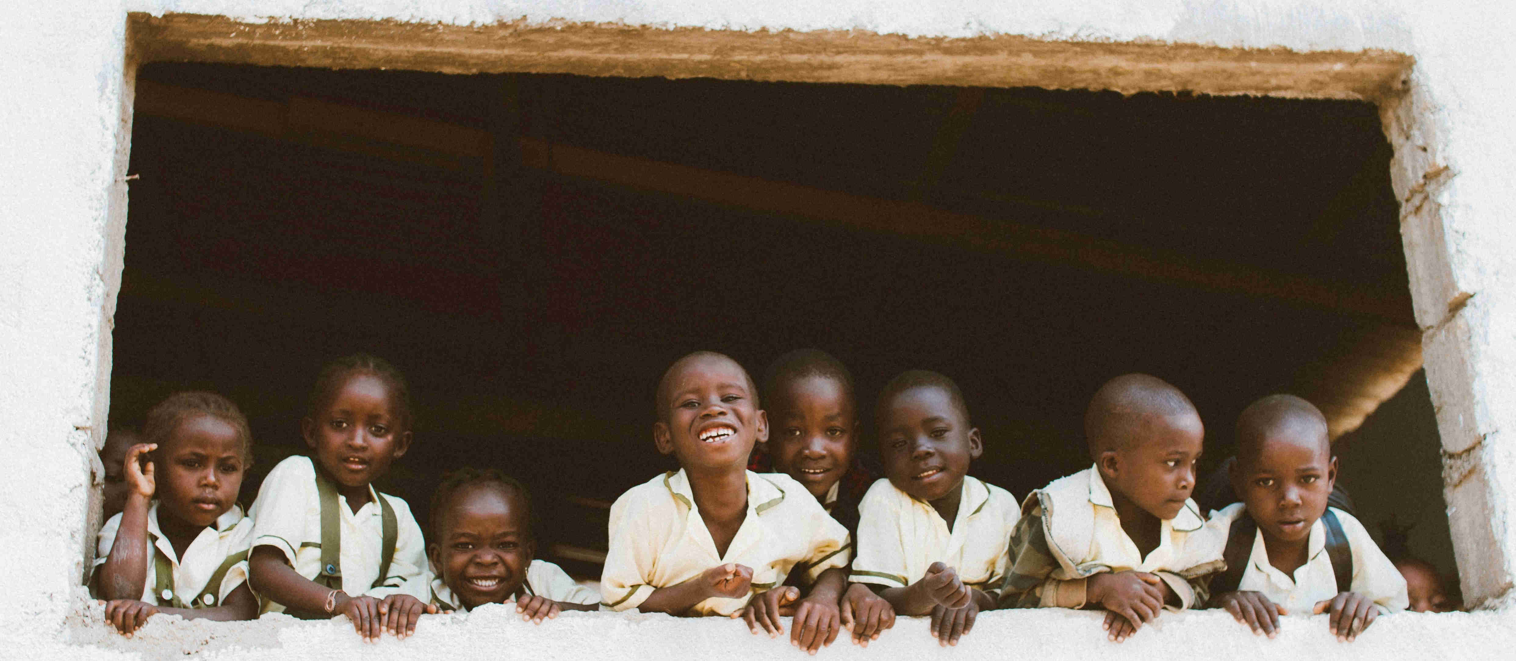 children looking out a window